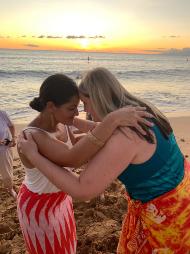 Hawaii cultural practitioner sharing traditional greeting, sunset